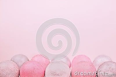 Composition of trendy coral and silver festive baubles on pastel background. Copy space. Stock Photo