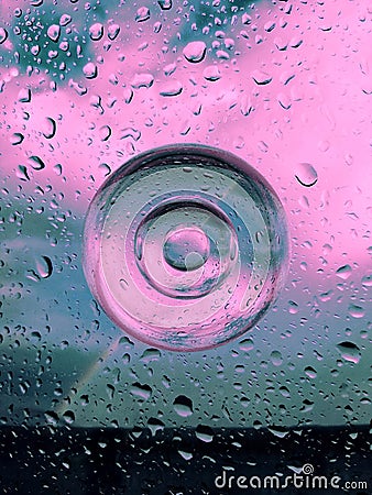 composition of water drops, glass circles in blue and pink color Stock Photo