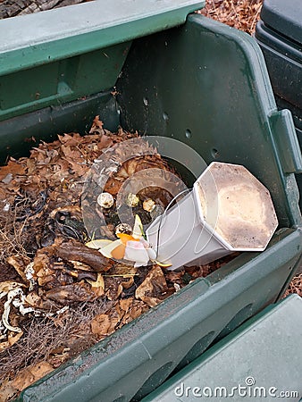 Compost bin with kitchen scraps container Stock Photo