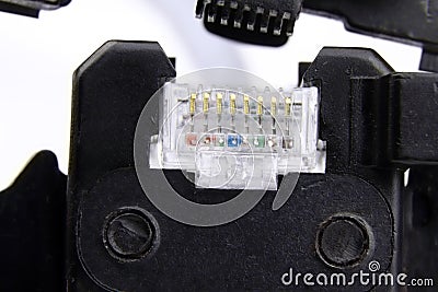 Compression of the Internet connector using a crimper for crimping RJ 45. Internet Network Connector, rj45.Crimping of a Stock Photo