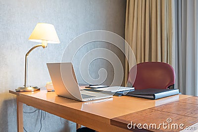 Computer display and office tools on desk in home. Desktop computer screen isolated. Modern creative workspace background. Stock Photo