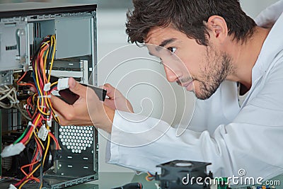 Computer engineer solving problem Stock Photo