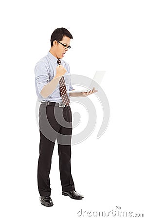 Computer engineer is standing and clench his hand Stock Photo