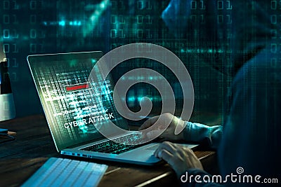 Computer hacker. Internet crime working on a code on laptop Stock Photo