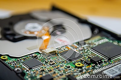 Computer Hard Disk Electronics Circuit, Macro Photo. Hard disk repairing concept, Data saving concept. Blur background with Stock Photo