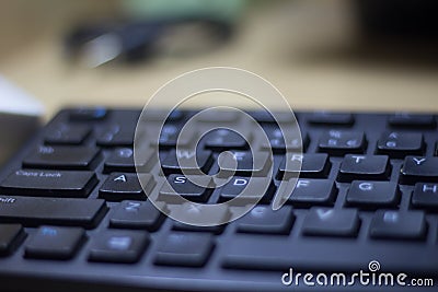 Computer keyboard closeup in black backlight Editorial Stock Photo