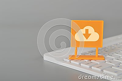 Computer keyboard with cloud download symbol Stock Photo