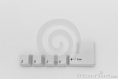Computer keyboard keys with 2020 enter written using the white buttons on white background Stock Photo