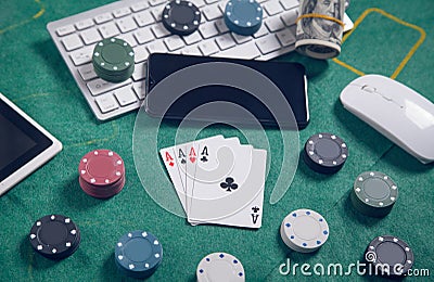 Computer keyboard, money, mouse, playing cards and chips. Online casino Stock Photo