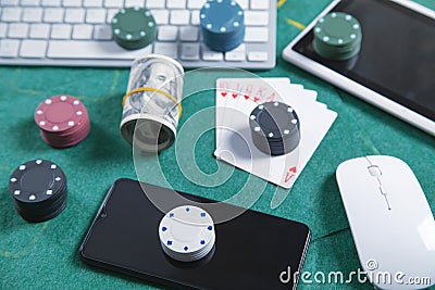 Computer keyboard, money, mouse, playing cards and chips. Online casino Stock Photo