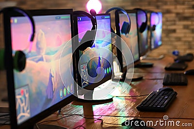 Computer monitors for video games tournament on table Stock Photo