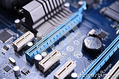 Computer motherboard and electronical components cpu gpu memory and different sockets for video card close up Stock Photo