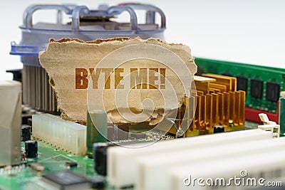 On the computer motherboard there is a cardboard with the inscription - Byte me Stock Photo