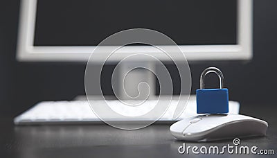 Computer and mouse on which there is a lock Stock Photo