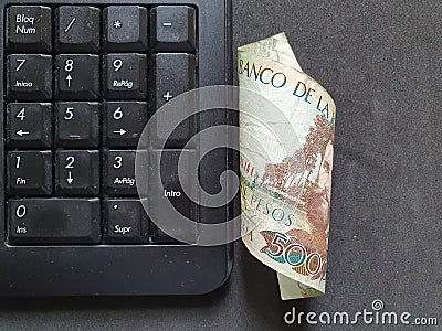 computer numeric keypad and Colombian money Stock Photo