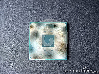 a computer processor with a lot of spoons on a dark background. Top view flat lay. central component for computers or laptops Stock Photo