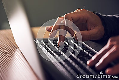 Computer programmer and hacker hands typing laptop keyboard Stock Photo