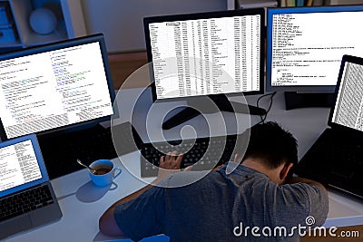 Computer programmer sleeping in the office Stock Photo