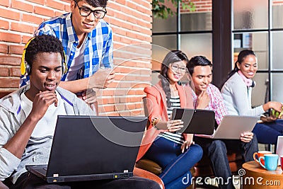 Computer programmer in start-up company coding Stock Photo