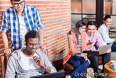 Computer programmer in start-up company coding Stock Photo