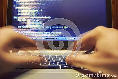 Computer programmer typing long code Stock Photo