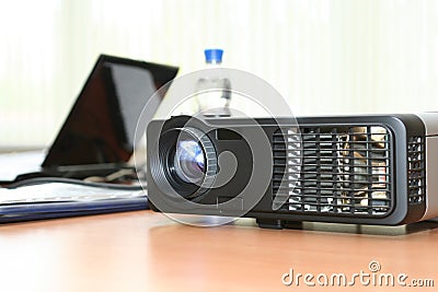 Computer projector and laptop in boardroom Stock Photo