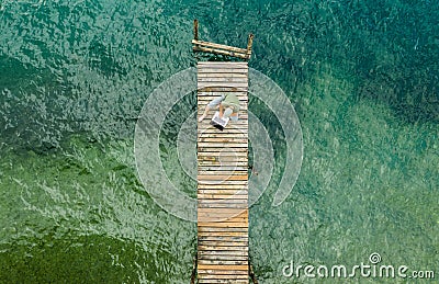 Computer Remote Work on Wooden Pier Aerial Stock Photo