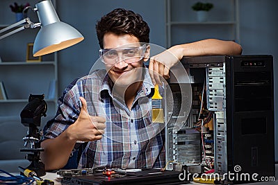 The computer repair man cleaning dust with brush Stock Photo
