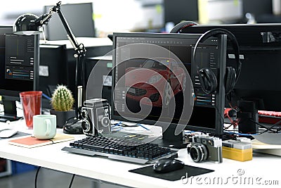 Computer Screen Showing Graphic Car Design on Office Table Working Stock Photo