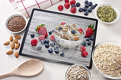 Computer Tablet Cereal Berries Nuts Grains Breakfast Stock Photo