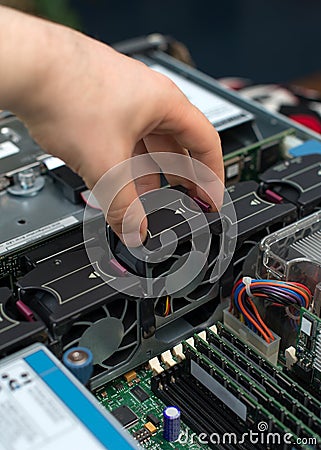 Computer technician installing cooler fan. Stock Photo