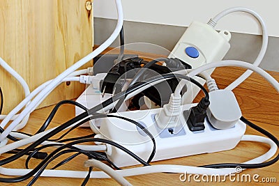 Power Cords in a Dangerously Tangled Mess Stock Photo