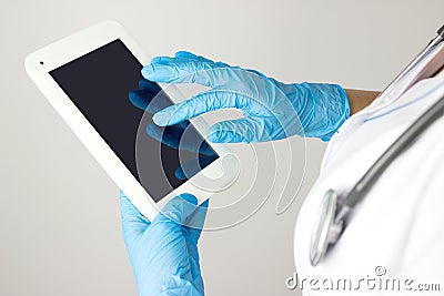 Computerization Of Healthcare System. Medicine doctor touching electronic medical record on tablet. Medical care technology Stock Photo