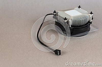 Computers and Components. New CPU fan against a gray background. Round aluminum device to cool the main CPU Stock Photo