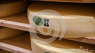 ComtÃ© cheese being matured on spruce planks Stock Photo