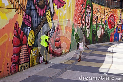 MEDELLIN, COLOMBIA, AUGUST 15, 2018: Mural painting in Comuna 13, Medellin Editorial Stock Photo