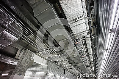 Comunications in underground on raw concrete and chrome metal Stock Photo