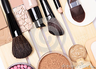 Concealer, primer, foundation, powder, blush with make-up brush Stock Photo
