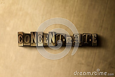 CONCENTRATE - close-up of grungy vintage typeset word on metal backdrop Cartoon Illustration