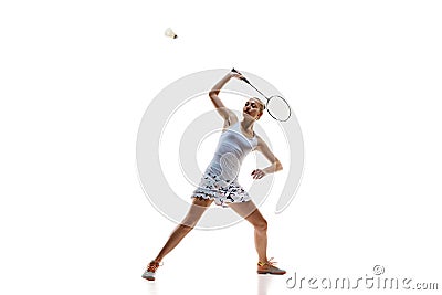 Concentrate young woman, badminton athlete in motion playing isolated over white background. Winning game Stock Photo