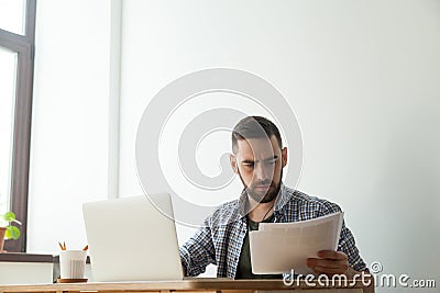 Concentrated bearded designer with pantone color swatch palette Stock Photo