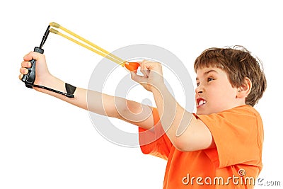 Concentrated boy with slingshot aim Stock Photo