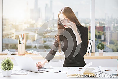 Concentrated businesslady working in office Stock Photo