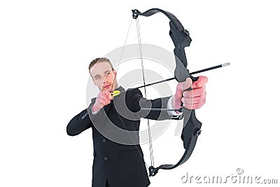 Concentrated businessman shooting a bow and arrow Stock Photo