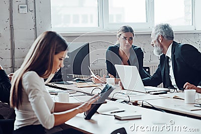 Concentrated colleagues having staff meeting Stock Photo