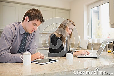 Concentrated couple surfing in the internet Stock Photo