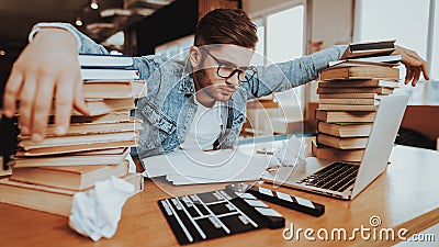 Concentrated Freelance Writer Working at Desk Stock Photo