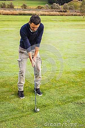 Concentrated golfer Stock Photo