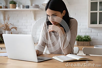 Happy beautiful young asian woman studying online using computer. Stock Photo