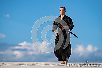 Man meditating before martial arts training Stock Photo